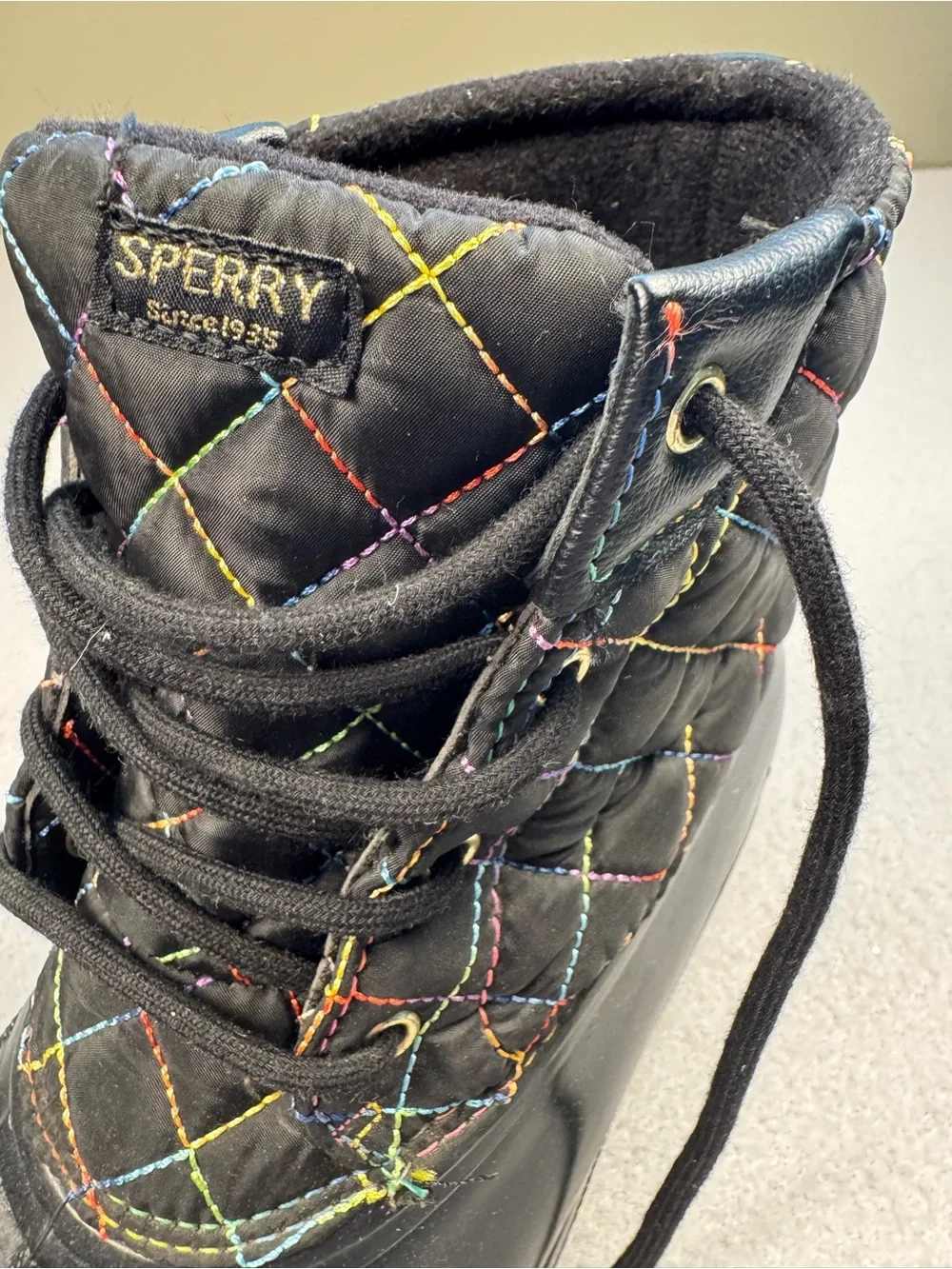 Sperry Black Quilted Lace-Up Rain Boots with Rainbow Stitching
